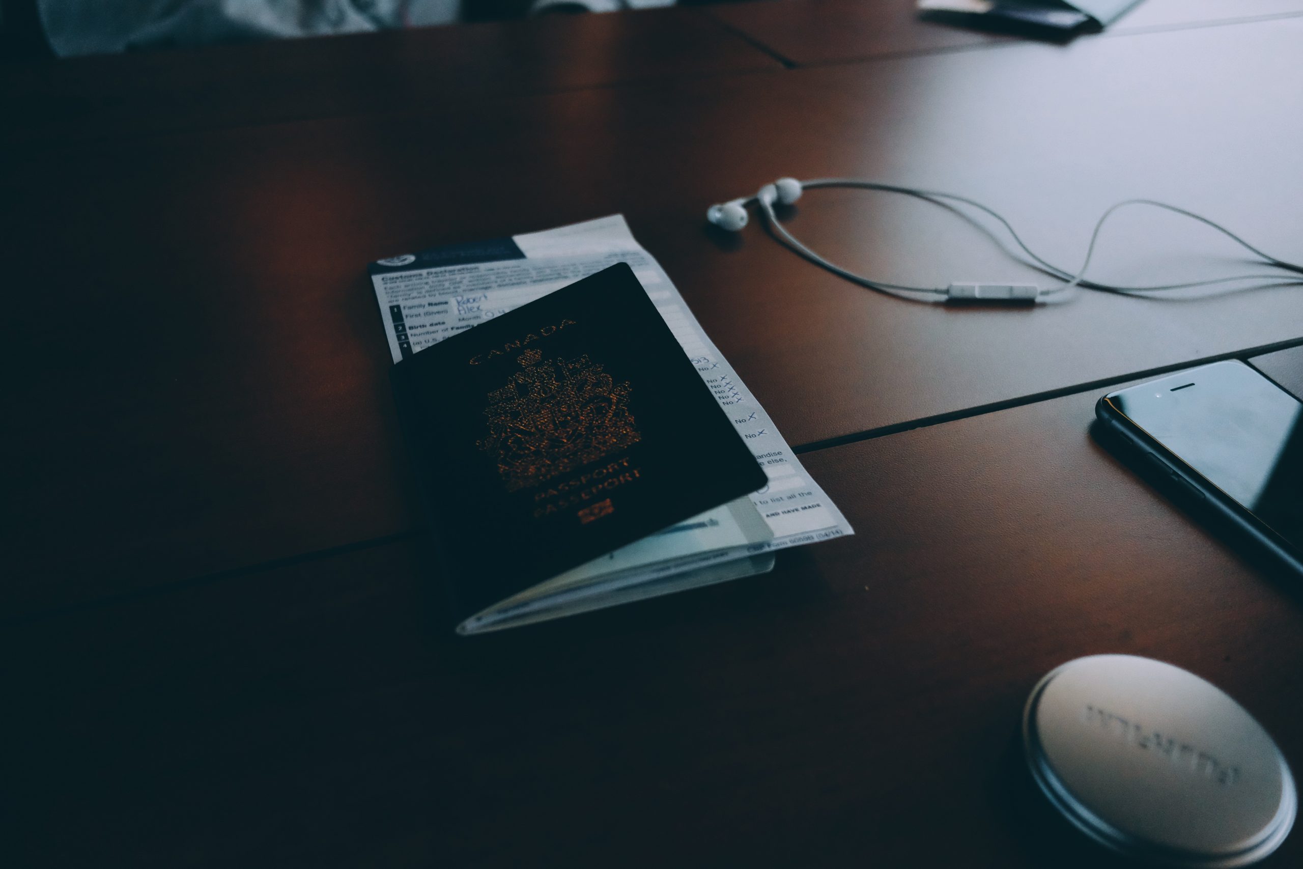 Passport and travel form on a desk, ready for an Australian conference visa application